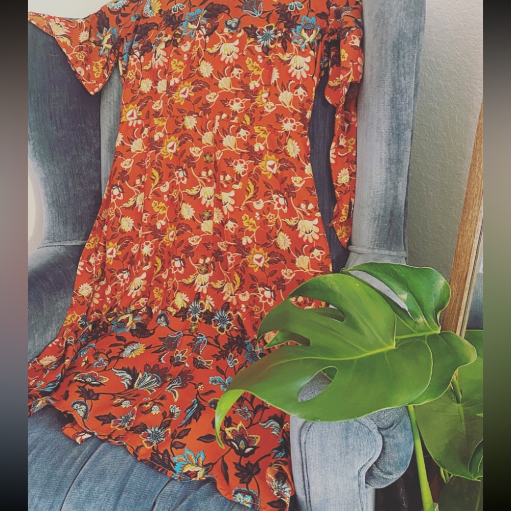 Tea party style coral dress with buttons, ties on the sleeves and back